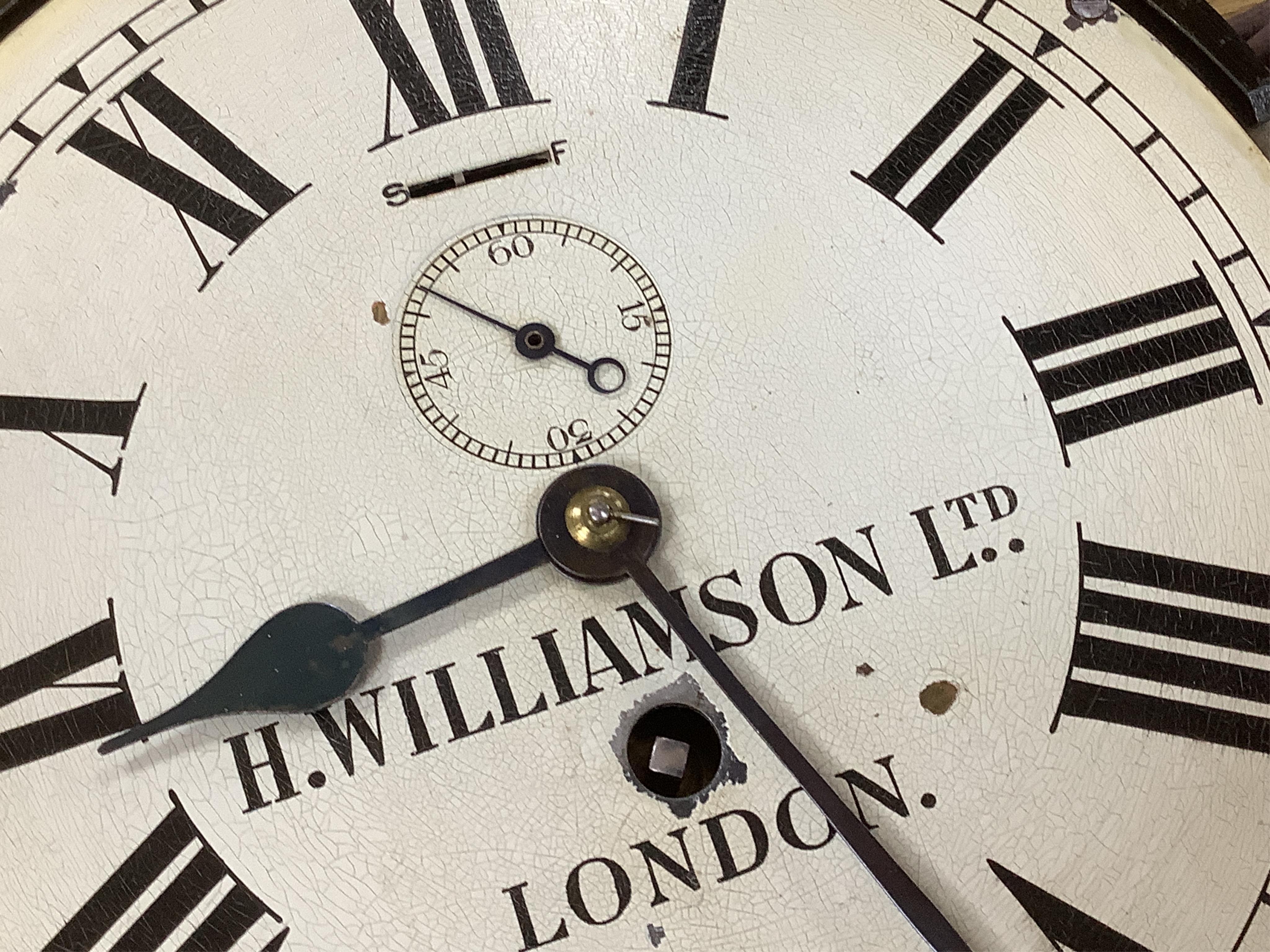 H Williamson Ltd, London, brass ships bulkhead timepiece with key, 28cm in diameter